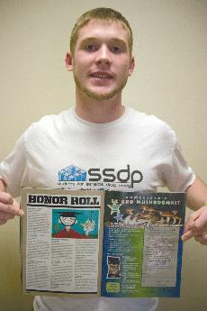 Kyle Maddy, former president of SSDP shows off his organizations mention in the August edition of High Times.
