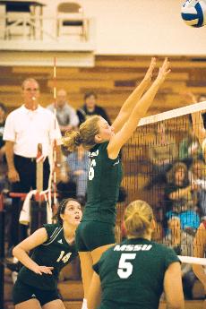 Sophomore Amelia Judge goes up for a block during a game against University of Nebraska-Omaha on Oct. 22.
