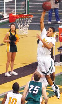 Freshman Jason Adams goes for a dunk in Southerns 85-69 win against Northwest Missouri State. Adams had 16 points in the game.
