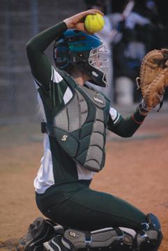 Catcher Madison Reed prepares to throw the ball back to the pitcher in the Mathis-Zenner Memorial Tournament this weekend. Southern split the two-day event, 2-2.
