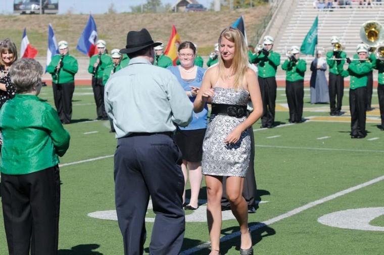 2011 Missouri Southern homecoming queen Sam Evans is greeted by University President Bruce W. Speck at the Oct. 1 homecoming football game which Southern lost 35-23. Evans is a junior criminal justice major minoring in biology, psychology and crime scene investigation. Evans ran as a representative of the Residence Halls Association.
