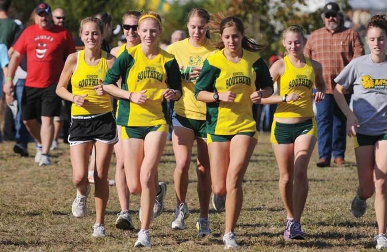 Members of the womens cross country team run in the Oct. 22 MIAA Championship meet. The Lions finished second among nine teams.
