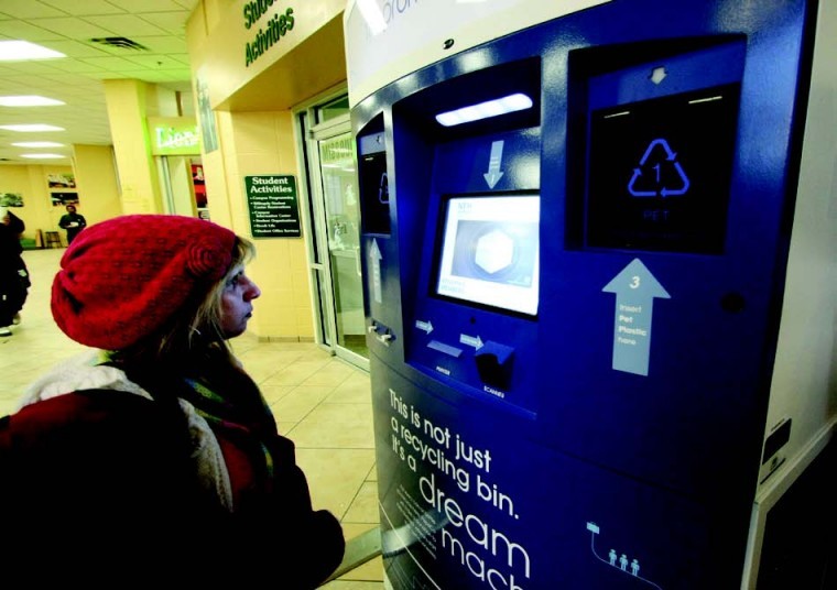 Marla Batten, sophomore nursing major, checks out the recycling kiosk located in the Lion’s Den last week.
