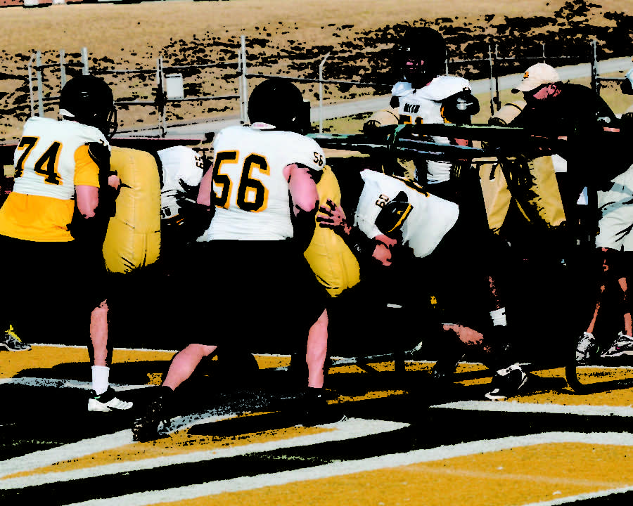Sophomores+Beau+Bounus+and+Brayden+Prough+help+with+blocking+drills+at+practice+last+week.+The+Lion+offensive+line+will+play+a+more+important+role+this+season+than+in+recent+years+due+to+a+new+option+offense+installed+by+first+year+Head+Coach+Daryl+Daye.%0A
