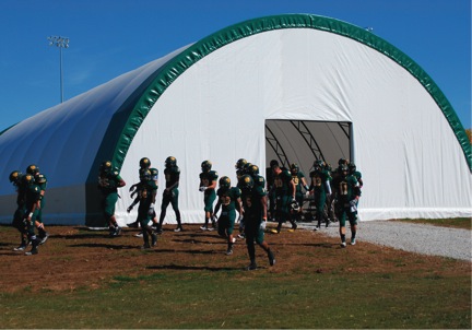Missouri Southern football players exit the new endzone facility during last weekend’s game against Northwest Missouri State. The facility was made possible by a fan’s donation.
