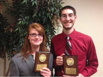 Johnathan Saunders and Jessica Andrews, senior political science majors, pose with their awards last weekend after competition at Northwest Missouri State. Both earned top attorney awards for their performances in the fictional case about a widow suing a scuba diving company.

