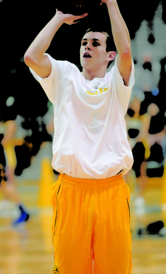 Freshman guard Austin Wright warms up before the home game against John Brown on Nov. 9. The Lions won 83-63.
