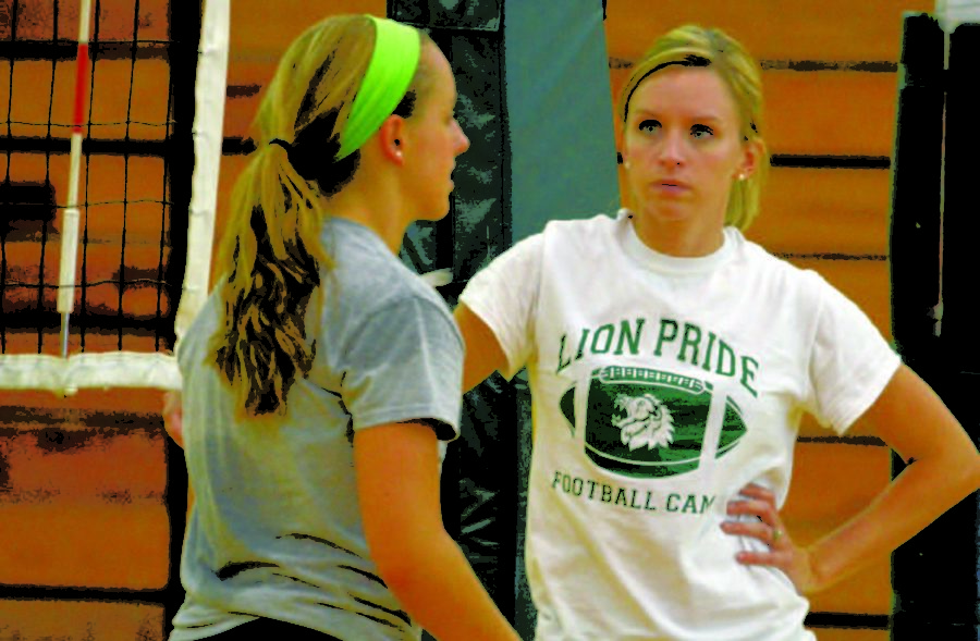 Interim Head Coach Rachel Kirkman listens to give coaching feedback to sophomore setter Abby Finder during practice this week.