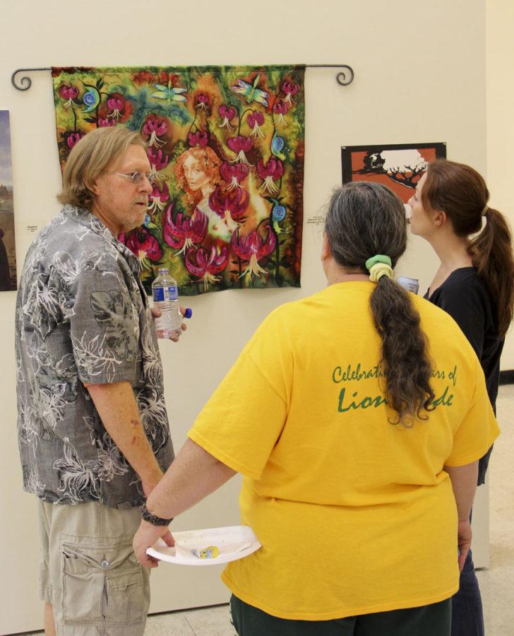 Students discuss the various art forms in the Reinventing the Renaissance exibit held in the Spiva Gallery at Southern on Sept. 24. From left: senior studio art major Philip Ledbetter, junior respitory tech. Deborah Vaughn and junior visual art major Jenny Journeycake.