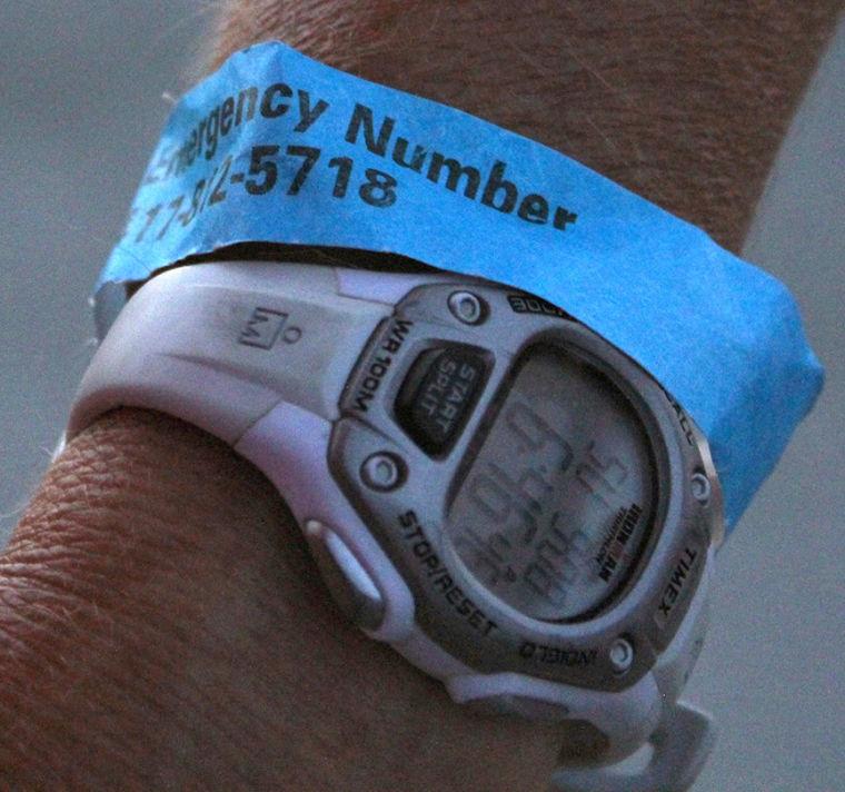 Lynn wears a wristband with an emergency call number. Each rider was issued a wristband to wear for the race. The Smiths had to use the emergency number when, on day two, Cody got a bloody nose. When they called, the race volunteers quickly drove up and provided medical assistance to the 13 year old.