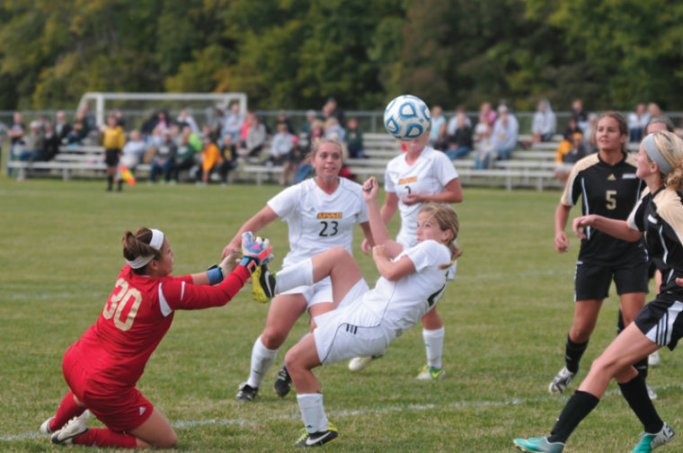 Sophomore Karley Thomas beats the goalie to the ball for a shot on goal for the Lions during the game against Lindenwood University on Oct. 6.