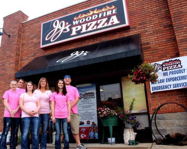 Employees of JJs Woodfire Pizza wear new pink company t-shirts that will be worn for the breast cancer awareness fundraisers during the month of October. From left to right are: Courtney Breamer, junior, dental hygiene; Jordan Duley; Lindsey Monson; Kelly Cook; Crystal Wagner, junior, criminal justice administration; and Tyler Kalbrleisch, senior, criminal justice administration. Photo taken Sept. 29.