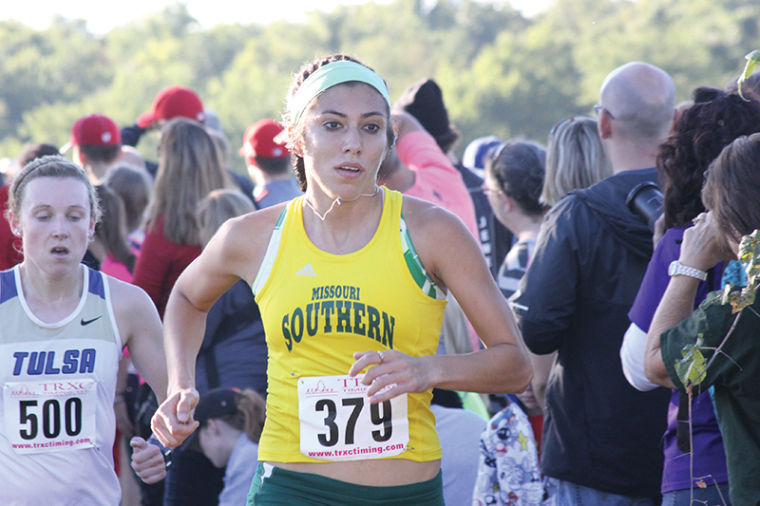 Junior Dora Eastin runs during the Southern Stampede on Sept. 21 when she led the Lions to a fifth place finish. Eastin placed tenth overall with a time of 17:54.99 and reaching her goal of an under 18 minute race.