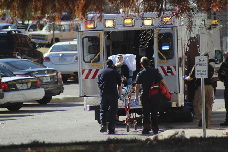A student is loaded into an ambulance on Monday, Nov. 18 outside Hearnes Hall.