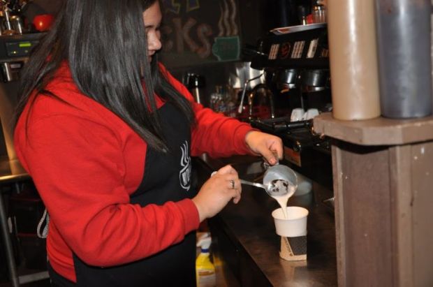 Barista Leilani Vaipulu pours a specialty drink for customers at the Joplin Avenue Coffee Company, 506 S. Joplin Ave. 