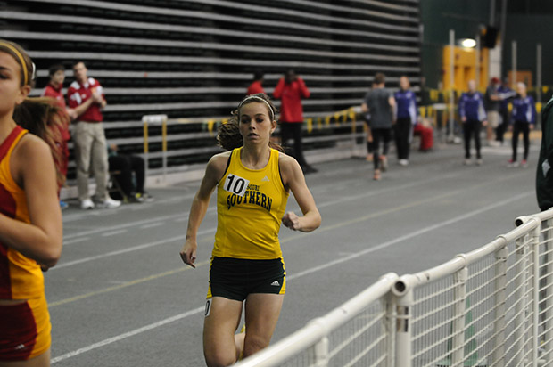 Sophomore Addie Mengwasser rounds the track at the Leggett & Platt Athletic Center during the MSSU Lion Invite on Feb 2, 2013