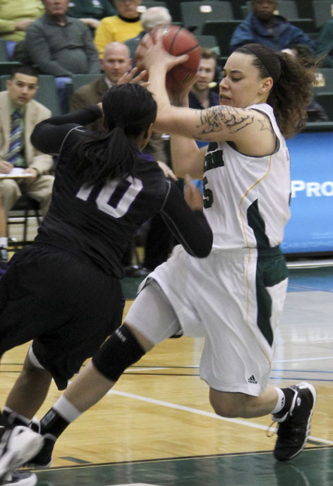 Junior guard Alexis Fitzpatrick puts on the brakes as she heads to basket.