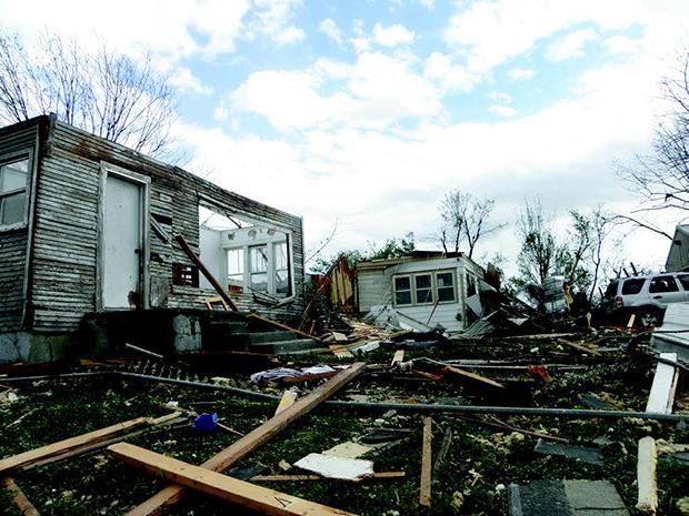 Destruction+lies+in+the+wake+of+an+EF-2+tornado+that+tore+through+around+90+homes+and+businesses+are+destroyed+with+one+fatality.