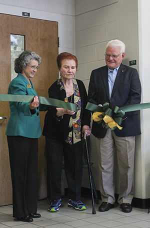 JoAnn Graffam, the vice president for development and executive director of MSSU foundation (left) helps Kolpin-Rubison (middle) cut the ribbon at the classroom dedication ceremony with the assistance of her son Ron Petersen (right).