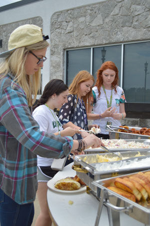 From left to right: Keesha Maynard, nursing major, Emily Brewer, business major, Jerrica Russell, bio-pre-med major, and Brittany Garland, criminal jutice major, help themselves to steaks, onion rings, coleslaw and garlic bread at the Great American Steakout Sept. 10 in Mayes Dining Hall.