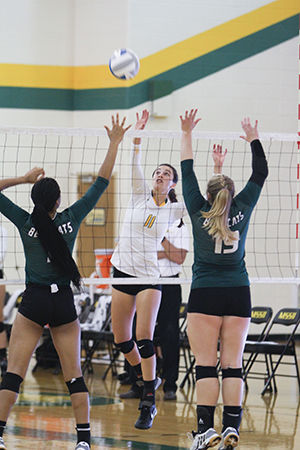 Senior outside hitter Katie Politte splits the defense of Northwest Missouri during the teams match on Sept. 27, 2014. The Lions fell in the contest 3-1 even though Politte had 11 kills.