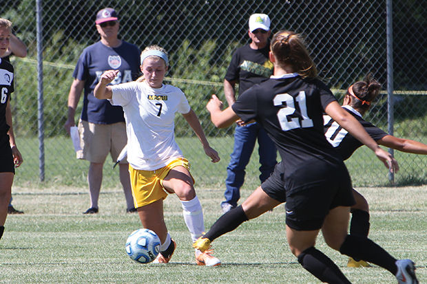 Freshman forward Hannah Bomar makes a move during the Lions contest on Sept. 14, 2014, against East Central that ended in a 3-3 tie after two overtimes. Bomar leads the Lions in assists with three and sits second in goals with another three.