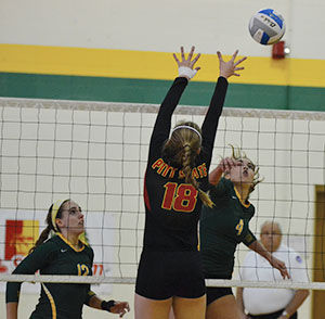Junior Callie Whetstone attempts to shoot around the block made by Pitt State on Nov. 11, 2014. The Lions got the victory in four sets, helped in large part by Whetstone who had nine kills and two blocks. Senior Katie Politte lead the team with 16 kills on the night.