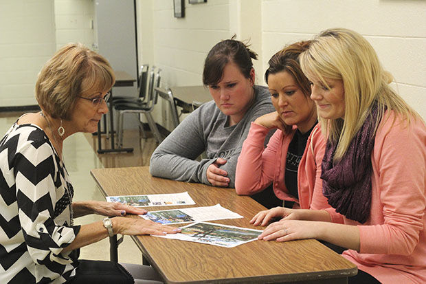 School of education associate proffesor, Becky Gallemore (left), discusses the details of the spring trip to Japan with Kendall Kirby (from right), a senior elementry education major, Jenn Mock, a senior special education major, and Mary Black, a senior special education major on Wednesday, Nov. 5 in the Taylor Education building.