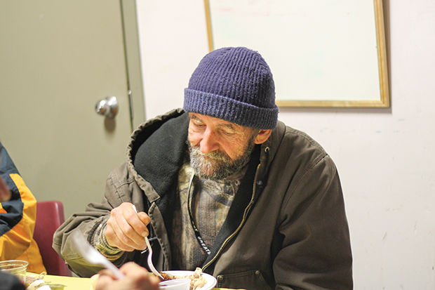 John Pugh, a homeless man in Joplin, partakes in a Thansgiving meal provided by the Watered Gardens shelter on Wednesday, November 25.