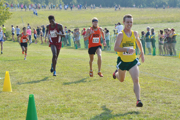 Senior Andrew Webster makes his way to the finishing line at the annual Southern Stampede held in Joplin on Sept. 20, 2014. The Lions finished in third place at the event with Webster crossing the line in 25:23.58, a time which secured him an eighth place finish.