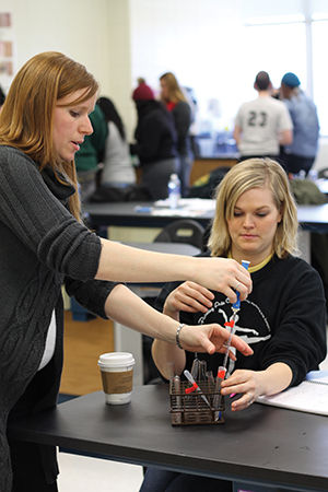 Teresa Boman (left), professor of biology, teaches junior biology major Ashley Farnsworth how to use the rolling pipet for their lab class on Thursday, Feb. 5 in Reynolds Hall. Missouri Southern is currently working to secure funding to renovate labs in Reynolds Hall.
