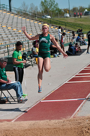 Junior Emily Paullus takes flight during the Bill Williams/Bob Laptad Invite on April 25, 2014. Paullus finished 12th respectively while the Lions picked up nin provisional marks overall.