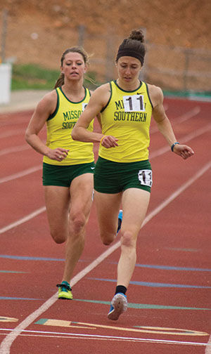 Senior Kelly Roberts and freshman Miranda Hill finish strong in the women’s 800-meter run at the Bill Williams/Bob Laptad Invitational on April 24, 2015. Roberts finished in 16th place with a time of 2.32.77. Hill finished in 17th with a time of 2.33.21.