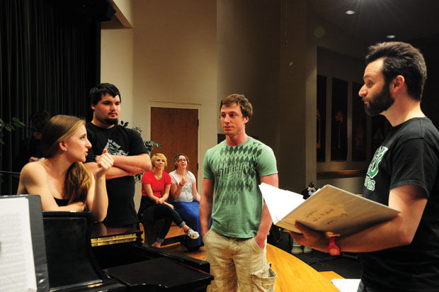 (From left to right) Dyanne Lile, senior vocal performance major, Seth Gripka, freshman vocal music education major, and Trey Burkhart, senior music industry major, rehearse a piece from Don Giovanni with assistant professor of music Jordan Wilson (right) on Wednesday, April 22, in Corley Auditorium.