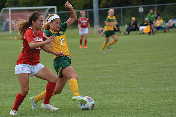 Senior Michaela Altvater shields off a Newman University defender in a home match-up against Newman at Hal Bodon field on Sept. 12, 2015. Altvater attempted one shot in the game and the Lions attempted 13 in total. The Lions survived two extra time periods before scoring the game-winning goal in the 107th minute.