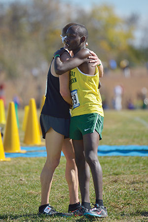 Freshman Vincent Kiprop congratulates a competitor at the 2015 NCAA Division Central Region Championship at the Tom Rutledge Cross Country Course on Nov. 7, 2015. Kiprop won the event qualifying for the NCAA Division II Championship hosted by Southern. Kiprop has won back-to-back individual titles and is seeking a third straight victory.
