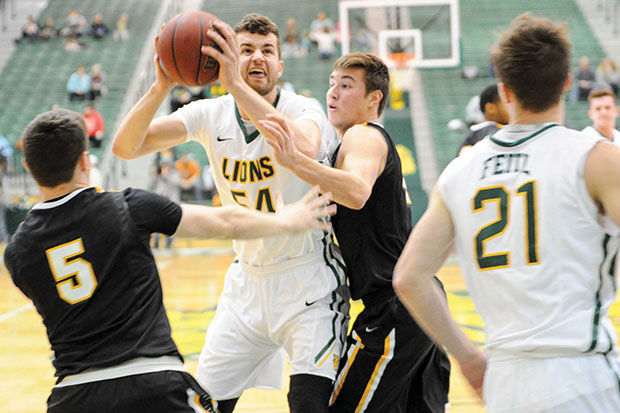 Junior Isaac Kreuer fighting off a double team on Robert Corn Court inside the Leggett & Platt Athletic Center against Fort Hays State on Feb. 13, 2016. Southern currently sits in third place in the conference as they’re trying to clinch the third seed and a first-round bye with a win over Pittsburg State tomorrow. PSU defeated Southern earlier this season in Pittsburg, Kan.