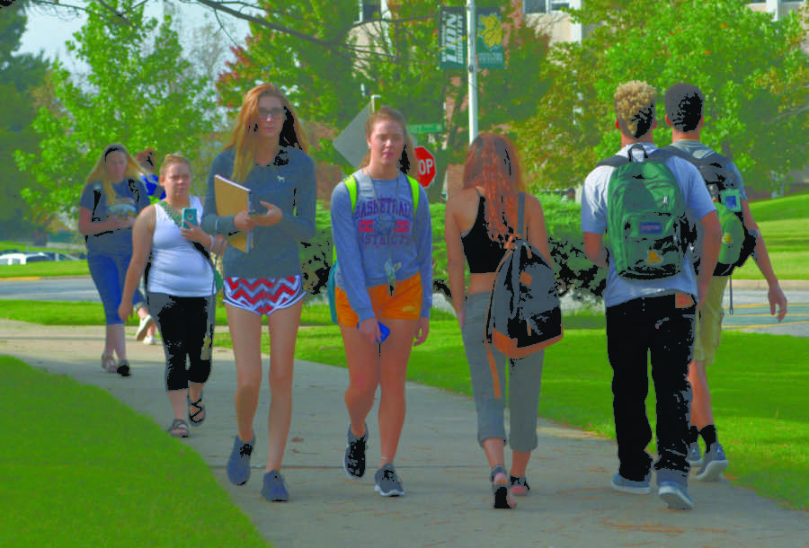 Students, including Payton Spering and Michaela Weston, walk on campus Thursday, Sept. 1, 2016. Campus is even more full of students since the 11 percent increase in enrollment.