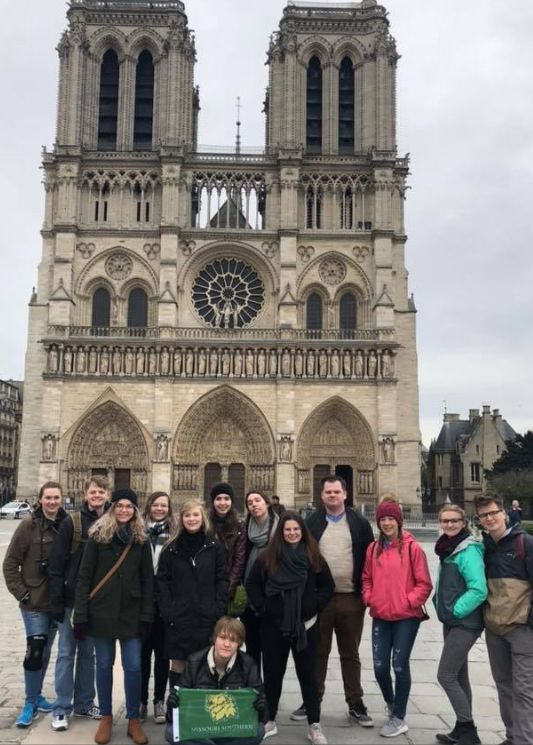 Students from the 2018 global journalism course in front of the Notre Dame cathedral in Paris. France.