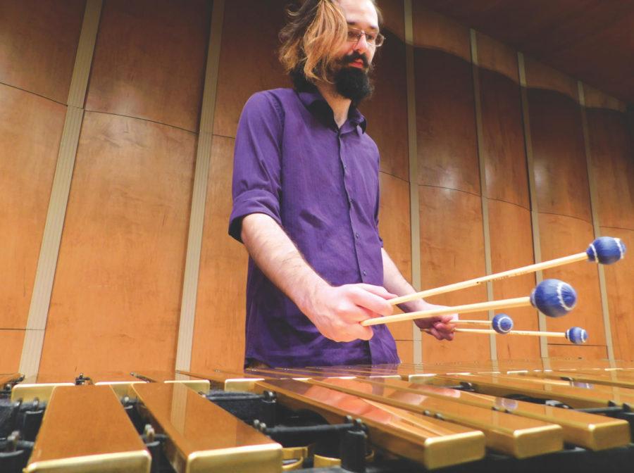Luke Randolph, senior, practices vibraphone inside Taylor Performing Arts Center.
