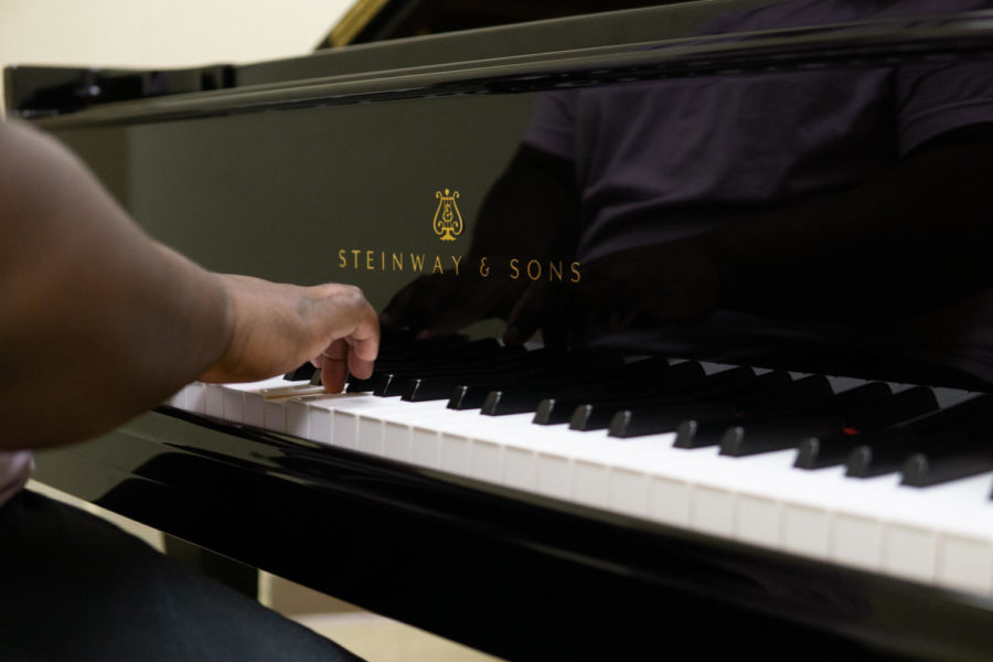 Jemetris Brown, senior general studies major, practices “Misty” by Erroll Garner on the new Steinway & Sons grand piano. 