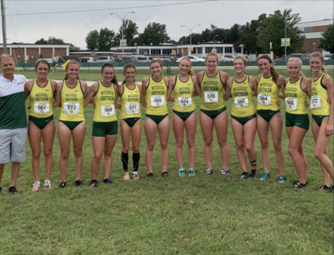 Coach Jamie Burnham with Southern’s women cross country team after their race on Sept. 21 
