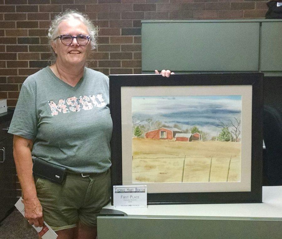 Susan Griffith  with watercolor painting Make Hay While the Sun Shines, fist place winner of the 24th annual Thomas Hart Benton Art Competition and Exhibition.