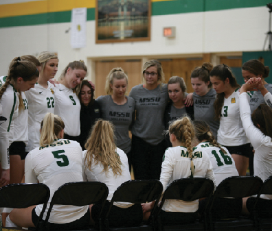 Lions in huddle during a timeout against the College of the Ozarks on Sept. 24.