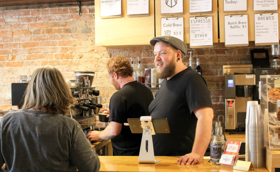 The+owner+of+Bearded+Lady+Coffee+Roasters%2C+Adam+Francis%2C+serves+a+customer.%C2%A0