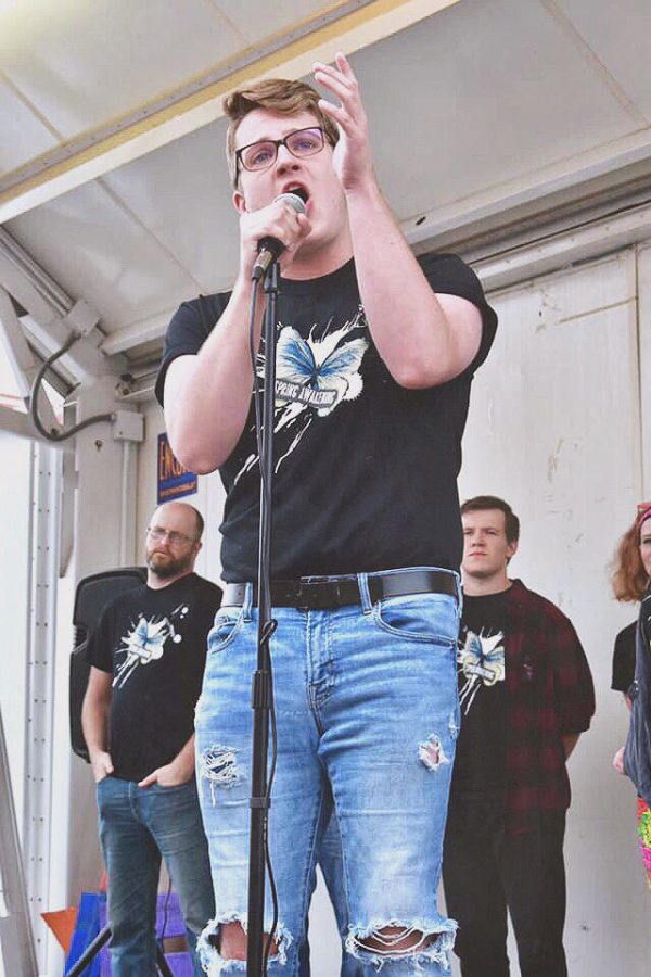 Tanner Munson, senior vocal performance major,  performing in the “Spring Awakening” production at the downtown Joplin, Missouri  Pride Parade on August 31, 2019. 