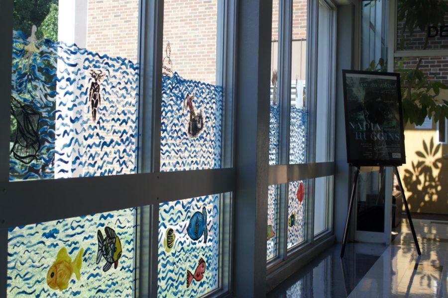 On Sept. 12 members of the community in conjunction with the Southerns art department created a mural on the windows located in Phinney Hall, part of the fine arts complex. 