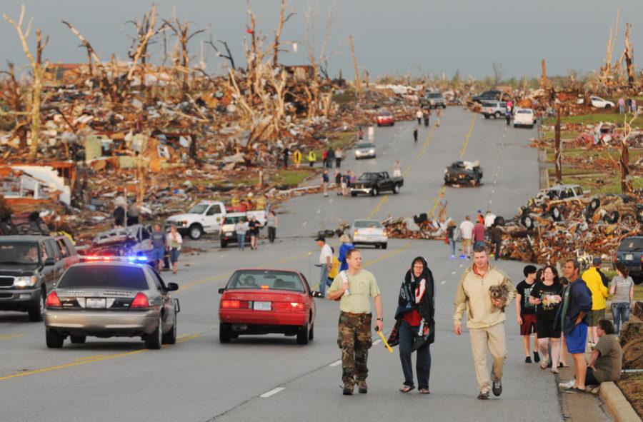 Survivors+walk+west+down+26th+street+in+Joplin%2C+Mo%2C+near+St.+Johns+Hospital+after+a+tornado+hit+Joplin%2C+Mo%2C+on+Sunday%2C+May+22%2C+2011.