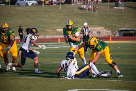 UCO linebacker Chase Faber (left) attempts to tackle MSSU quarterback Dawson Herl (right)