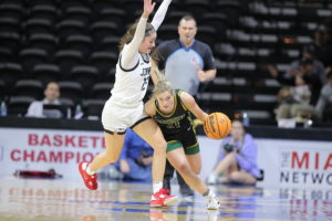 Lacy Stokes drives past the UCM defender during the MIAA championship game on Sunday, March 5th at the Municipal Auditorium in Kansas City, MO.